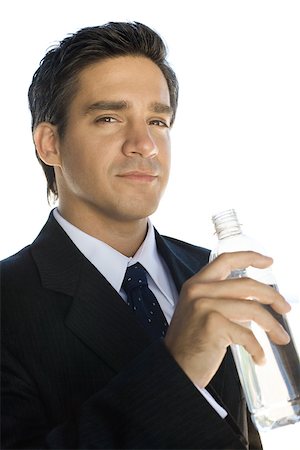 relax businessman silhouette - Businessman holding water bottle, looking at the camera, portrait Stock Photo - Premium Royalty-Free, Code: 695-03379592