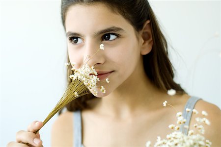 simsearch:695-03380090,k - Teen girl smelling flowers, close-up Stock Photo - Premium Royalty-Free, Code: 695-03379866