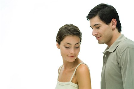 side profile portrait eyes closed studio - Young couple with eyes closed, man standing behind woman, portrait Stock Photo - Premium Royalty-Free, Code: 695-03379862
