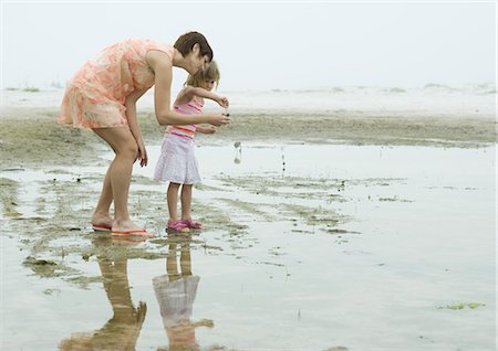 Mother and daughter on beach, full length Stock Photo - Premium Royalty-Free, Code: 695-03373517