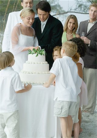 someone cutting cake - Scene from beach wedding Stock Photo - Premium Royalty-Free, Code: 695-03373652