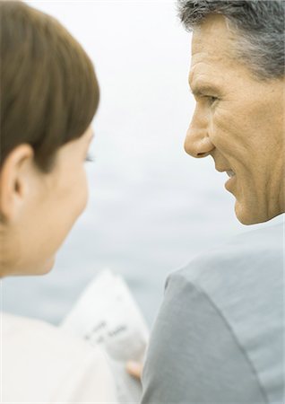 simsearch:695-05771557,k - Couple reading newspaper together, water in background Stock Photo - Premium Royalty-Free, Code: 695-03373785