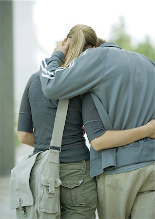 Young couple walking, rear view Stock Photo - Premium Royalty-Free, Code: 695-03373913