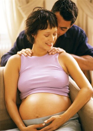 simsearch:632-01140106,k - Man massaging pregnant woman's shoulders Stock Photo - Premium Royalty-Free, Code: 695-03384025