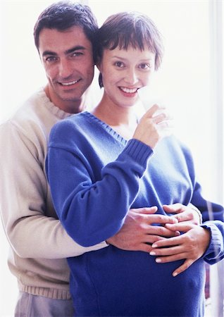 simsearch:632-01140071,k - Man with arms around pregnant woman, portrait Foto de stock - Sin royalties Premium, Código: 695-03384046