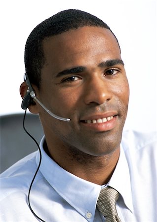 Man wearing headset, close-up, portrait Stock Photo - Premium Royalty-Free, Code: 695-03384069