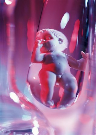 Plastic baby doll in test tube, close-up Stock Photo - Premium Royalty-Free, Code: 695-03384283