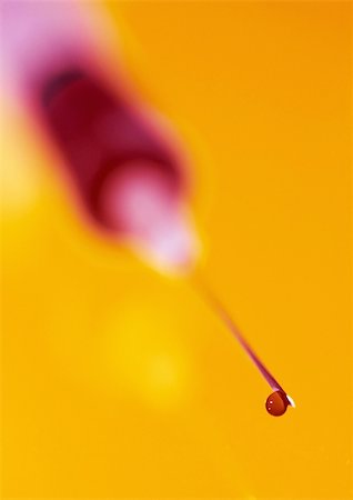 Syringe, close-up, blurred Stock Photo - Premium Royalty-Free, Code: 695-03384292