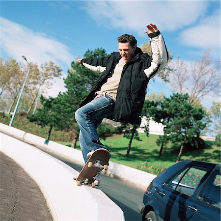 skate stunts - Young man skateboarding Stock Photo - Premium Royalty-Free, Code: 695-03384706