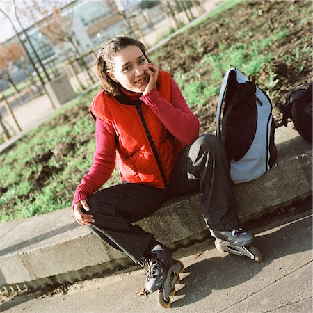sports and in line skating - Young woman wearing inline skates, portrait Stock Photo - Premium Royalty-Free, Code: 695-03384712