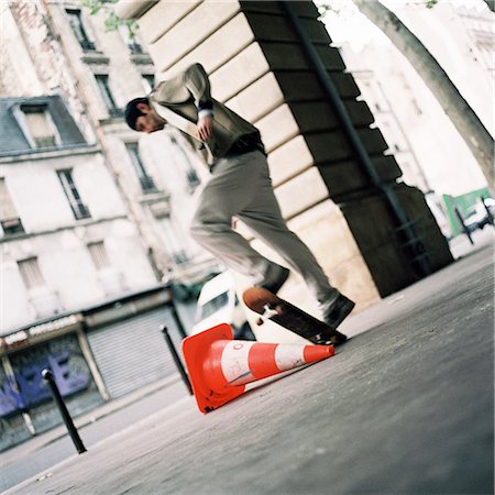 pylon in city - Young man performing skateboard trick Stock Photo - Premium Royalty-Free, Code: 695-03384721