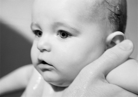 simsearch:695-03384923,k - Adult's hands holding baby under arms, close-up, b&w Stock Photo - Premium Royalty-Free, Code: 695-03384938