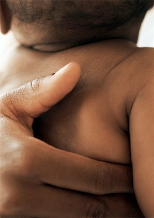 simsearch:695-03384923,k - Adult hand on baby's back, close-up Stock Photo - Premium Royalty-Free, Code: 695-03384954