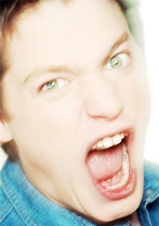 Teenage boy shouting, close-up, portrait Stock Photo - Premium Royalty-Free, Code: 695-03384995