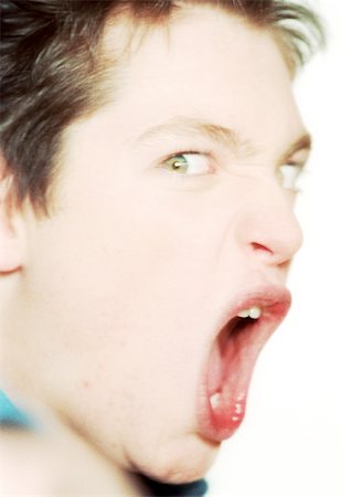 Teenage boy shouting, close-up, portrait Stock Photo - Premium Royalty-Free, Code: 695-03384997