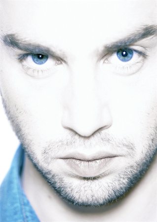 dark hair blue eyes males - Man's face, close-up, portrait Stock Photo - Premium Royalty-Free, Code: 695-03385020