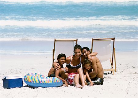 swimsuit mother hugs son - Family posing for photo on beach Stock Photo - Premium Royalty-Free, Code: 695-03385196