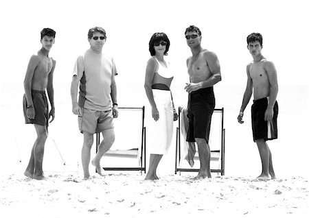 Adults standing on beach, b&w Stock Photo - Premium Royalty-Free, Code: 695-03385209