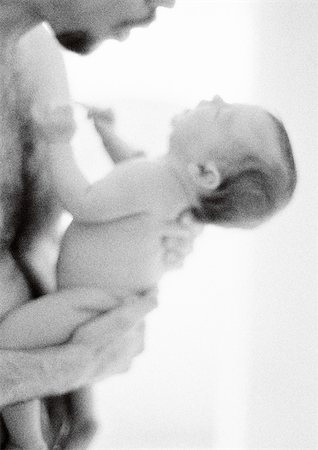 simsearch:695-03384923,k - Father holding infant against bare chest, side view, b&w Stock Photo - Premium Royalty-Free, Code: 695-03385505