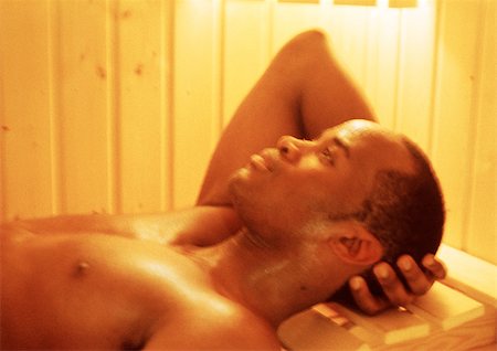 Man lying down in sauna Stock Photo - Premium Royalty-Free, Code: 695-03385565