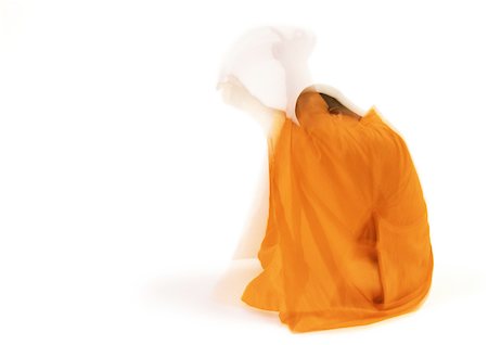 simsearch:695-03385803,k - Buddhist monk meditating, side view, blurred motion Stock Photo - Premium Royalty-Free, Code: 695-03385748