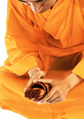 simsearch:695-03385803,k - Buddhist monk meditating, holding devotional objects Stock Photo - Premium Royalty-Free, Code: 695-03385760