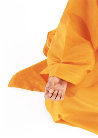 simsearch:695-03385803,k - Buddhist monk's hand on knee in lotus position Stock Photo - Premium Royalty-Free, Code: 695-03385763