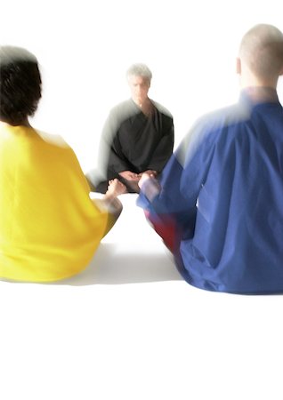 People sitting on floor indian style, meditating, blurred Stock Photo - Premium Royalty-Free, Code: 695-03385776