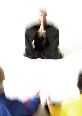 pray silhouette - People sitting on floor in lotus position, meditating, blurred Stock Photo - Premium Royalty-Free, Code: 695-03385787