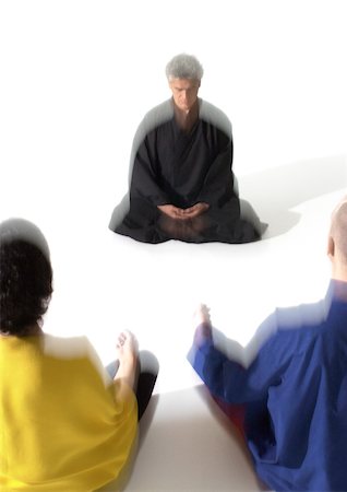 People sitting on floor indian style, meditating, blurred Stock Photo - Premium Royalty-Free, Code: 695-03385781