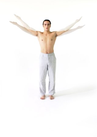 simsearch:693-06323954,k - Topless man standing flapping arms, full length Fotografie stock - Premium Royalty-Free, Codice: 695-03385798