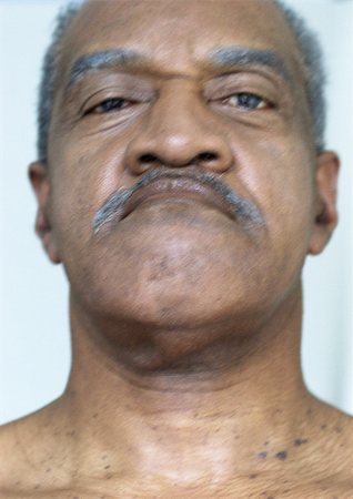 Mature man looking at camera, portrait, close-up Stock Photo - Premium Royalty-Free, Code: 695-03385946