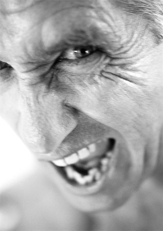 dental pictures black & white - Mature man making face, portrait, close-up, b&w Stock Photo - Premium Royalty-Free, Code: 695-03385948