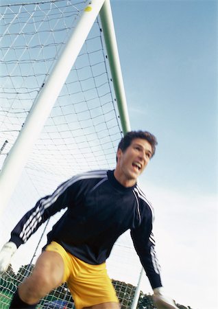 recreational sports league - Goal keeper at soccer match, portrait. Stock Photo - Premium Royalty-Free, Code: 695-03386382