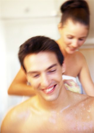 Woman washing nude man's back Stock Photo - Premium Royalty-Free, Code: 695-03386521