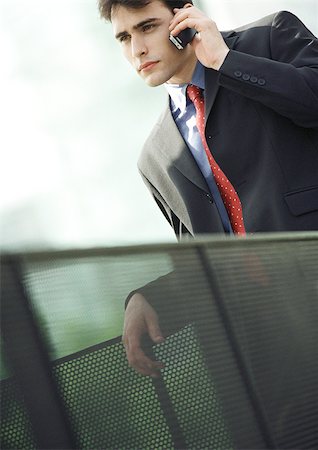 simsearch:695-05776257,k - Businessman using cell phone, close-up Stock Photo - Premium Royalty-Free, Code: 695-03386712