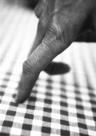 Fingers on table, close-up, b&w Stock Photo - Premium Royalty-Free, Code: 695-03386754