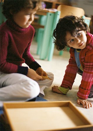 simsearch:695-05776481,k - Two children on floor, close-up Stock Photo - Premium Royalty-Free, Code: 695-03386777