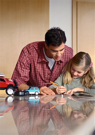 pic of a girl inside a car - Father looking at what daughter is writing. Stock Photo - Premium Royalty-Free, Code: 695-03386940