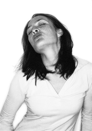 silhouette black and white - Woman puckering, portrait Stock Photo - Premium Royalty-Free, Code: 695-03387100