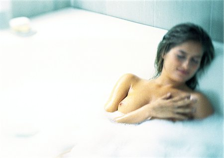 reclining bathing beauty - Woman in bubble bath, hand over left breast Stock Photo - Premium Royalty-Free, Code: 695-03387130