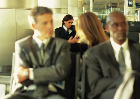 simsearch:695-03388701,k - Group of business people sitting together in airport lounge Stock Photo - Premium Royalty-Free, Code: 695-03387539