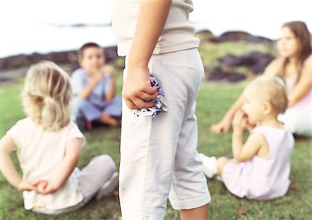 simsearch:632-01150360,k - Children sitting on grass in circle, blurred Fotografie stock - Premium Royalty-Free, Codice: 695-03387622