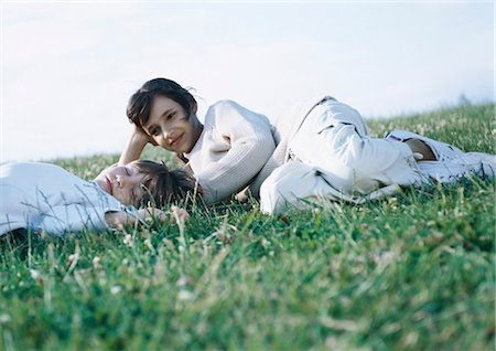 Boy and girl lying on grass Stock Photo - Premium Royalty-Free, Code: 695-03388096