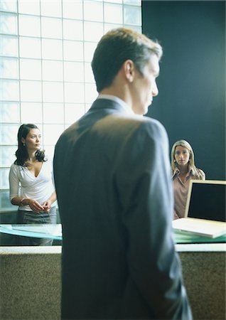 rebuking - Man and two women in office Stock Photo - Premium Royalty-Free, Code: 695-03388167