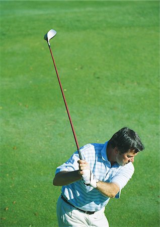 simsearch:693-03304456,k - Golfer swinging Foto de stock - Sin royalties Premium, Código: 695-03388224