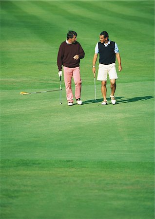 recreational sports league - Two golfers walking on golf course Stock Photo - Premium Royalty-Free, Code: 695-03388221