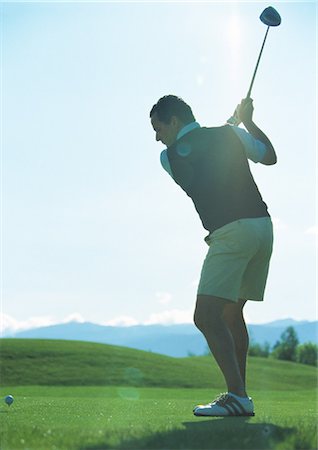 simsearch:649-06305707,k - Golfer swinging Stock Photo - Premium Royalty-Free, Code: 695-03388239