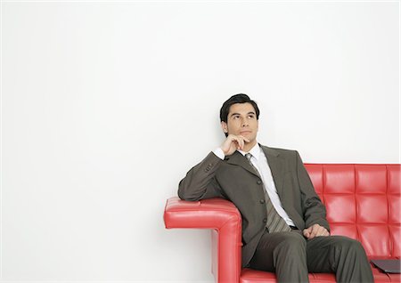 simsearch:632-08886967,k - Businessman sitting on couch Foto de stock - Royalty Free Premium, Número: 695-03388329