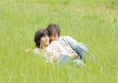 simsearch:632-01150072,k - Young couple lying in grass together Stock Photo - Premium Royalty-Free, Code: 695-03388536